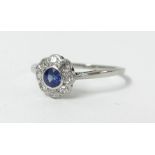An 18ct white gold diamond and sapphire cluster ring, size O.
