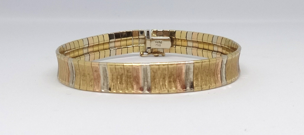 A 18ct Saudi Arabia gold multi coloured and textured bracelet, marked '750', approx 24gms.