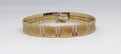 A 18ct Saudi Arabia gold multi coloured and textured bracelet, marked '750', approx 24gms.