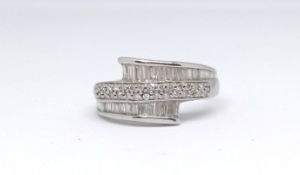 A 14ct white gold and diamond contemporary ring marked '585', set with baguette cut diamonds, size