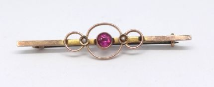 A 9ct ruby and pearl set bar brooch.