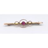 A 9ct ruby and pearl set bar brooch.