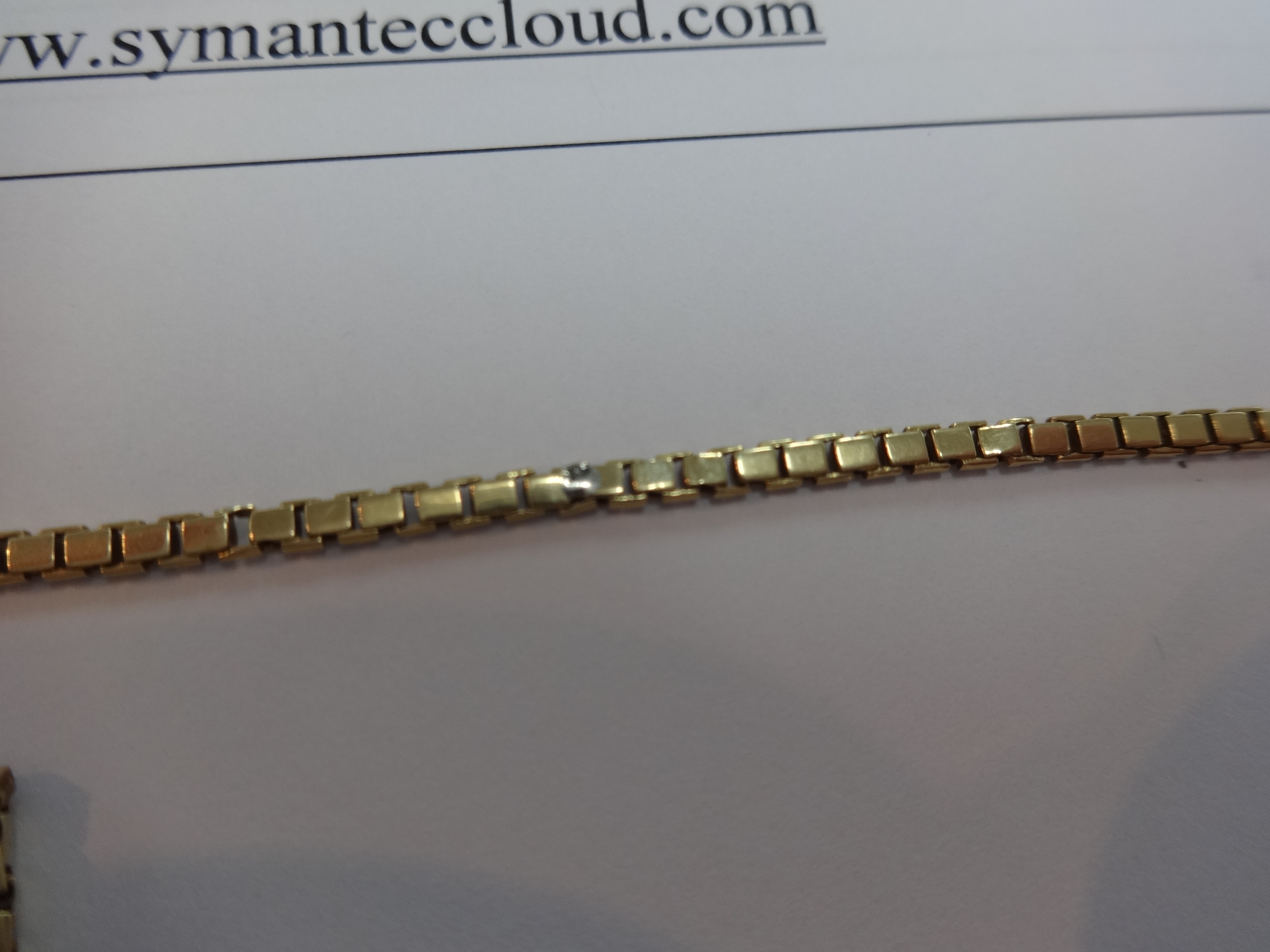 A 9ct gold chain and cross, approx 28.80gms. - Image 2 of 2