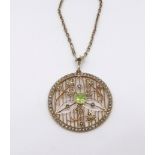 A 9ct pendant set with peridot and seed pearl set on fine 9ct chain, approx 13.8gms.