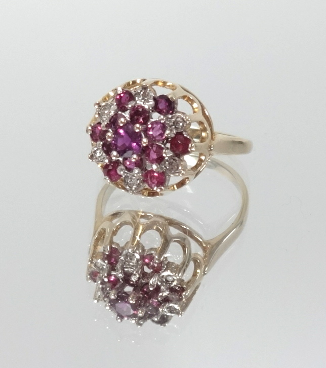 A 9ct gold ruby and diamond cluster ring, size L.