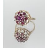 A 9ct gold ruby and diamond cluster ring, size L.