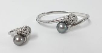 An 18ct white gold diamond and south sea pearl bangle and matching ring, approx 40gms.