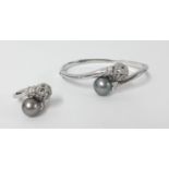 An 18ct white gold diamond and south sea pearl bangle and matching ring, approx 40gms.