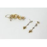 A 15ct diamond flower brooch and earrings.
