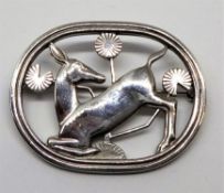 Georg Jenson, a Stirling silver designer brooch 'The Kneeling Deer', 4.5mm x 3.5mm, 15.80gms.