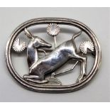 Georg Jenson, a Stirling silver designer brooch 'The Kneeling Deer', 4.5mm x 3.5mm, 15.80gms.