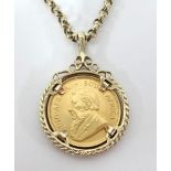 A gold 1981 1/4oz krugerrand mounted on a 9ct gold chain, total weight 23.90gms.