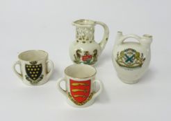 Goss and crested ware including puzzle jug, Plymouth Coat of Arms (4).