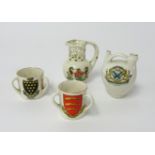 Goss and crested ware including puzzle jug, Plymouth Coat of Arms (4).