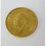 A Geo V gold sovereign, 1929 (SA).