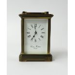A Charles Frodsham brass carriage clock with platform escapement.