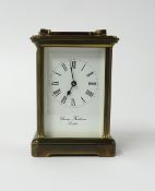 A Charles Frodsham brass carriage clock with platform escapement.