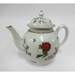 A 19th century Chinese porcelain teapot decorated with flowers.