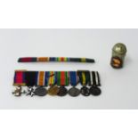 A set of eight miniature Great War medals including 'MID' and ribbon bar.