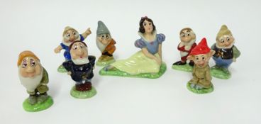 Wade Pottery set of eight Snow White figures with certificate.