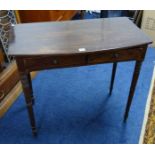 A Victorian mahogany side table fitted with two drawers on ring turned legs.