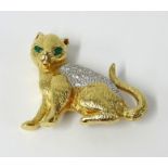 Modern gilt cat brooch with diamond and emerald effect stones