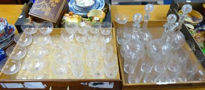 A collection of vintage and etched drinking glasses together with four decanters, approx 47 pieces.