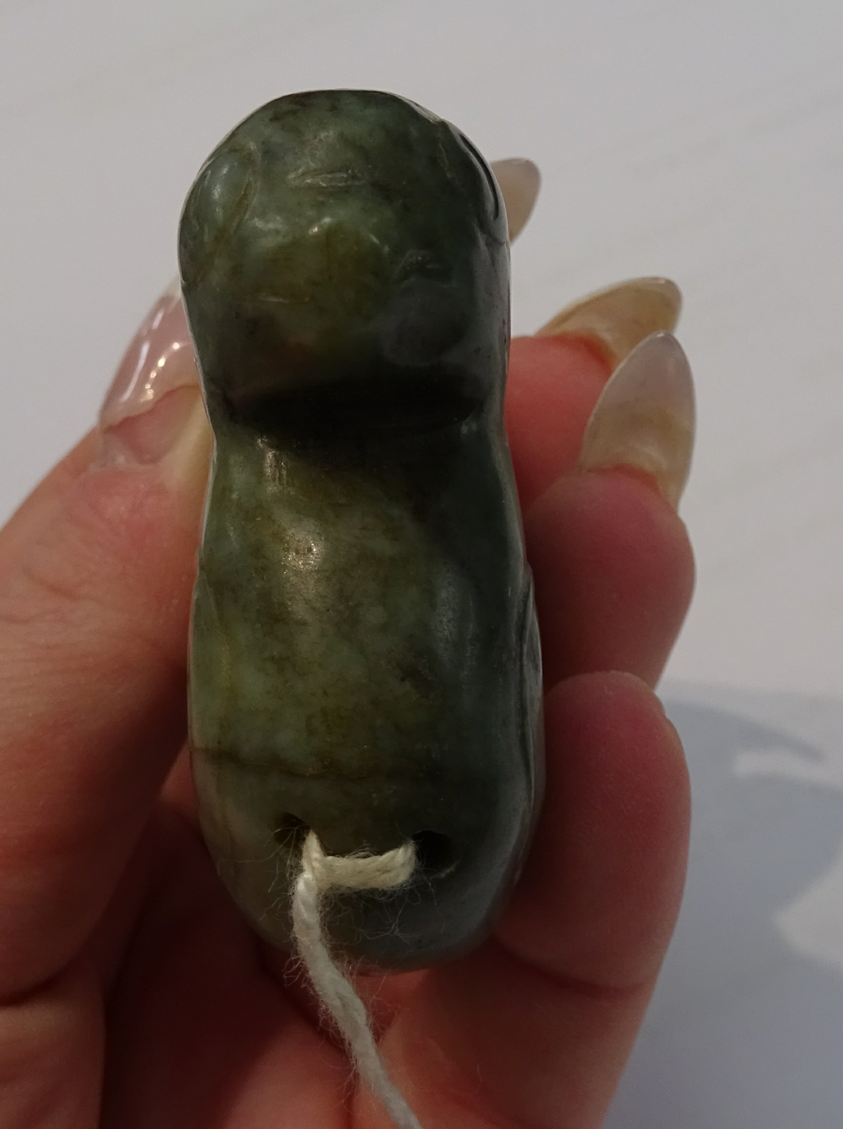 An oriental carved jade figure, a carved pig and dark green jade duck pendant, the tallest 7cm (3). - Image 10 of 10