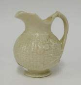 Belleek, a porcelain jug with basket decoration black mark 'Belleek' height 10cm