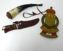 A horn powder flask, Royal Marine painted tin badge marked 'Tonanti', and an American hunting knife,