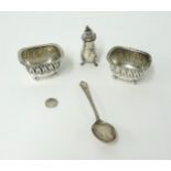 Silver salts on bun feet, silver pepper pots etc.