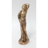A bronze sculpture, standing nude.