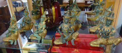 Seven gilded metal Alesia (Tibetan figures) on wood carving