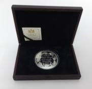 A 2013 Prince George 5oz silver coin with certificate, boxed.