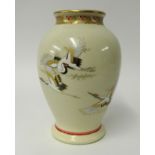 A Japanese earthenware vase decorated with cranes, signed, height 28cm