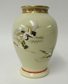 A Japanese earthenware vase decorated with cranes, signed, height 28cm