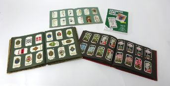 General collection of cigarette cards in three albums.