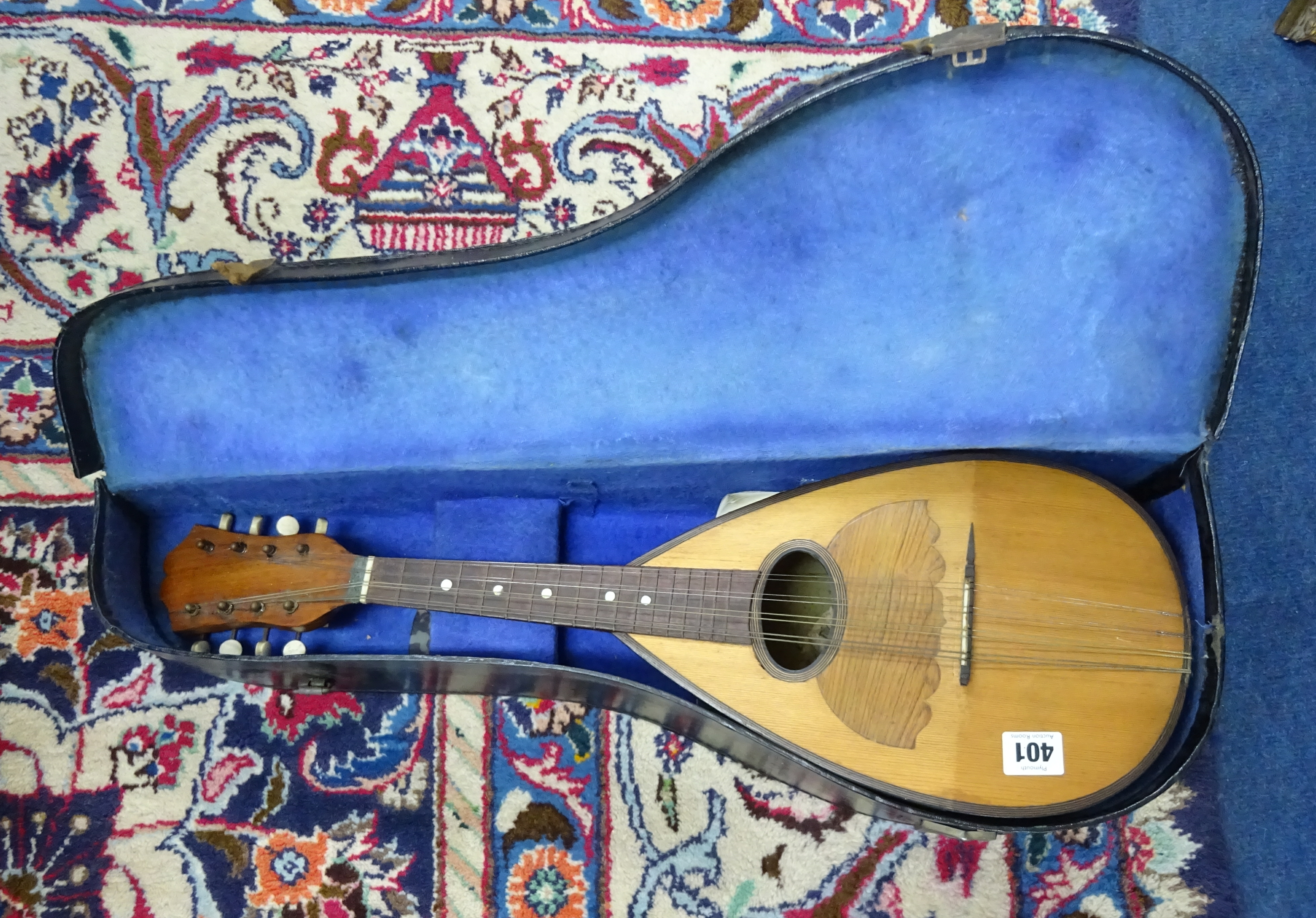 A Mandolin, cased.