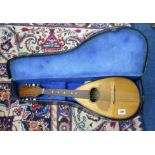 A Mandolin, cased.