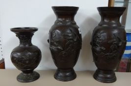 A pair bronze Oriental vases, height 30cm and a similar smaller vase (3).