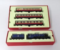 Hornby, 00 gauge Flying Scotsman loco 4-6-2, 60103 and three Flying Scotsman coaches, boxed.
