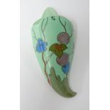 Clarice Cliff wall pocket decorated with stylised flowers and fruits on a green ground, height 32cm