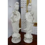 Pair of reproduction blanc de blanc figures, height 37cm.