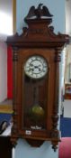 Victorian Vienna type wall clock the pediment with carved eagle.