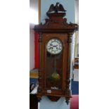 Victorian Vienna type wall clock the pediment with carved eagle.