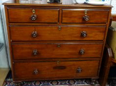 A Victorian mahogany chest of drawers fitted with two short and three long drawers.