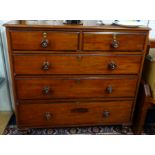 A Victorian mahogany chest of drawers fitted with two short and three long drawers.