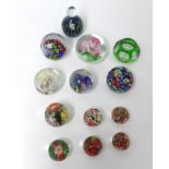 A collection of 12 paperweights including Mdina (12).