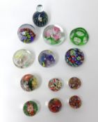 A collection of 12 paperweights including Mdina (12).