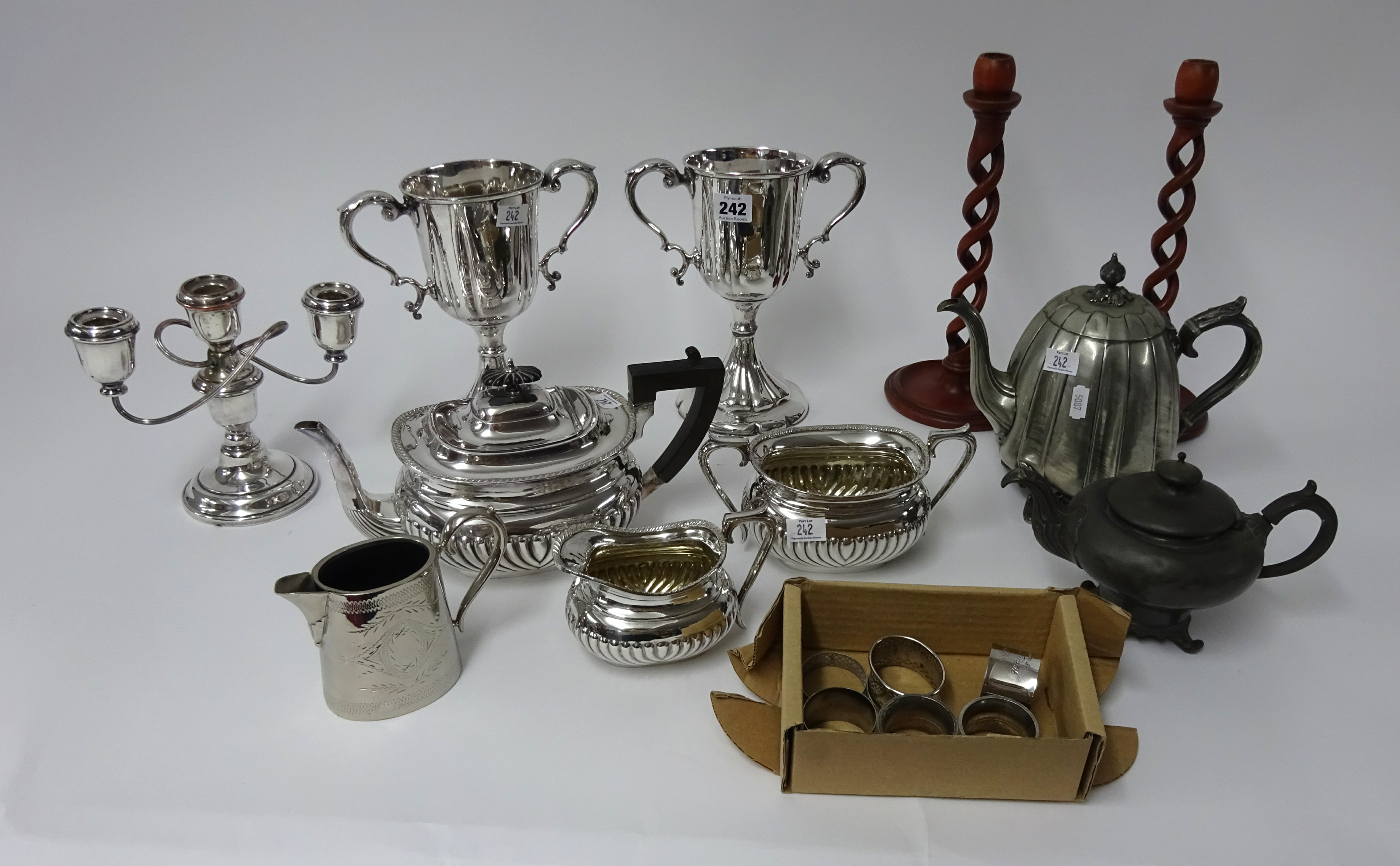 Collection of various silver plated wares and pair of open wood barley twist candle sticks.